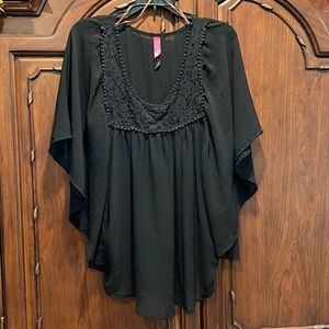 Black sheer top with bat wing style sleeves and crocheted yoke detail. EUC